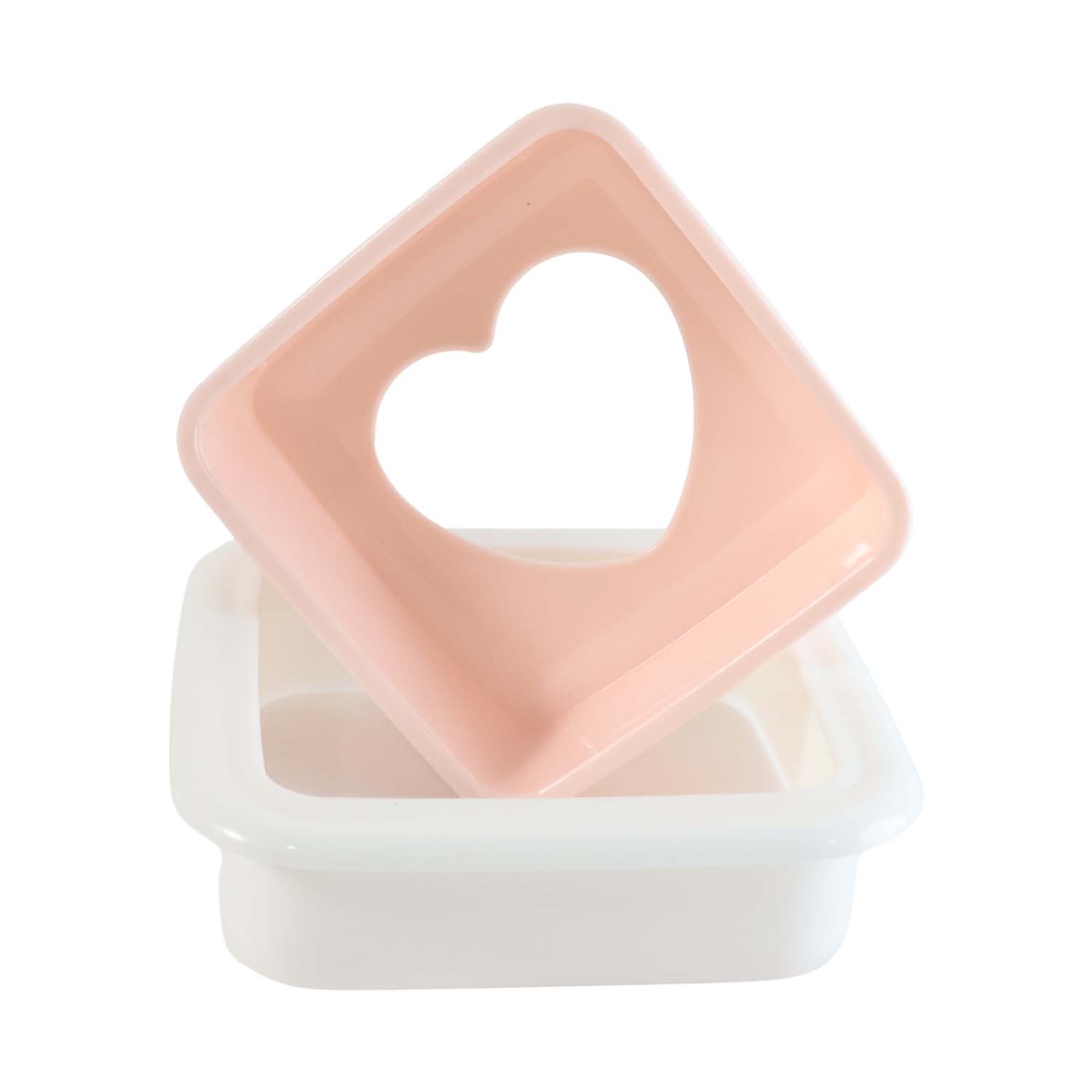 Close-up of heart bread mold design on sandwich cutter