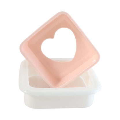 Close-up of heart bread mold design on sandwich cutter
