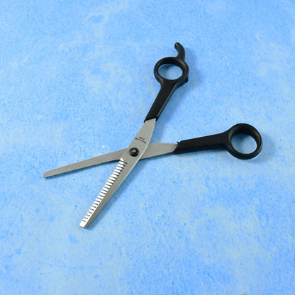Close-up angled view of hair thinning scissors focusing on cutting details