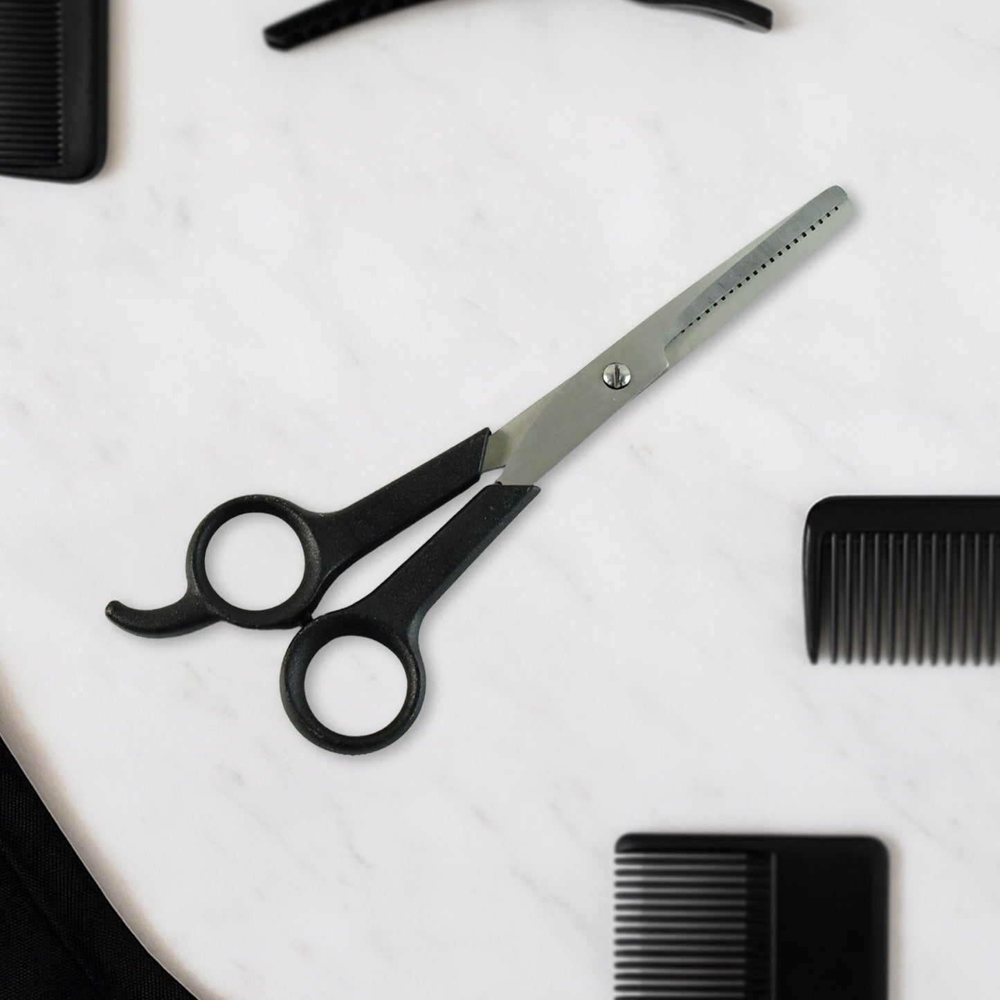 Hair thinning scissors showing detailed micro-toothed blade for bulk reduction