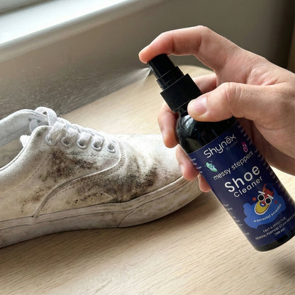 Shoe Cleaner Spray applied on white sneakers to remove stains