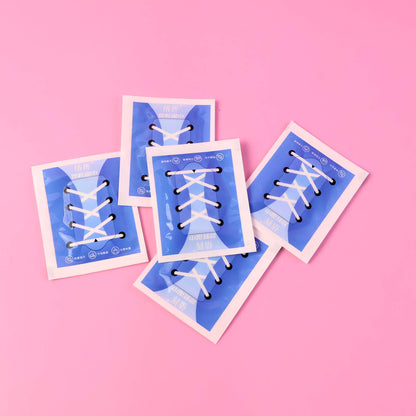Front view of resealable shoe cleaning wipes packet
