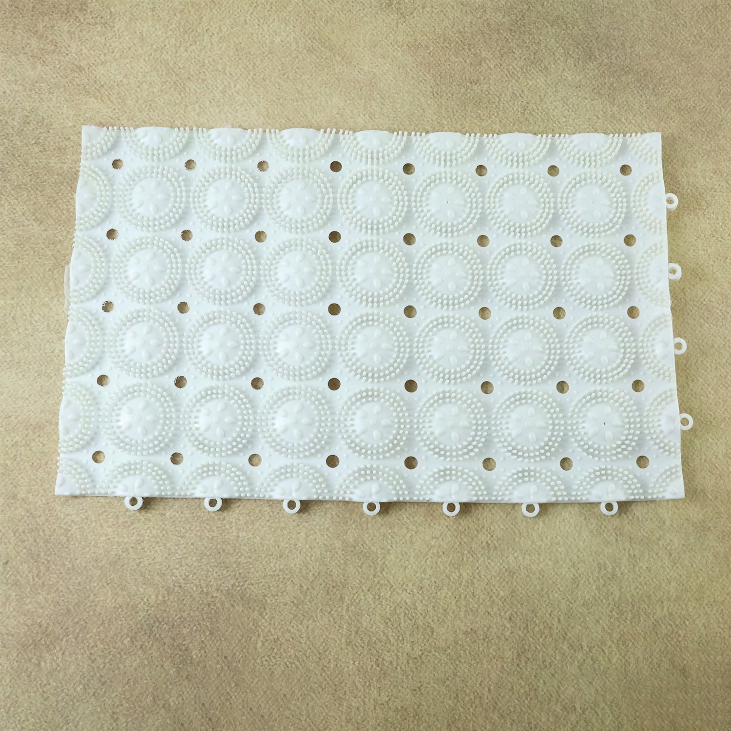 Person standing on textured anti-slip massage bath mat