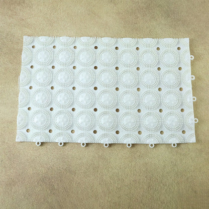 Person standing on textured anti-slip massage bath mat