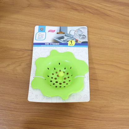 Durable silicone strainer shown with center pull knob for hygienic removal.