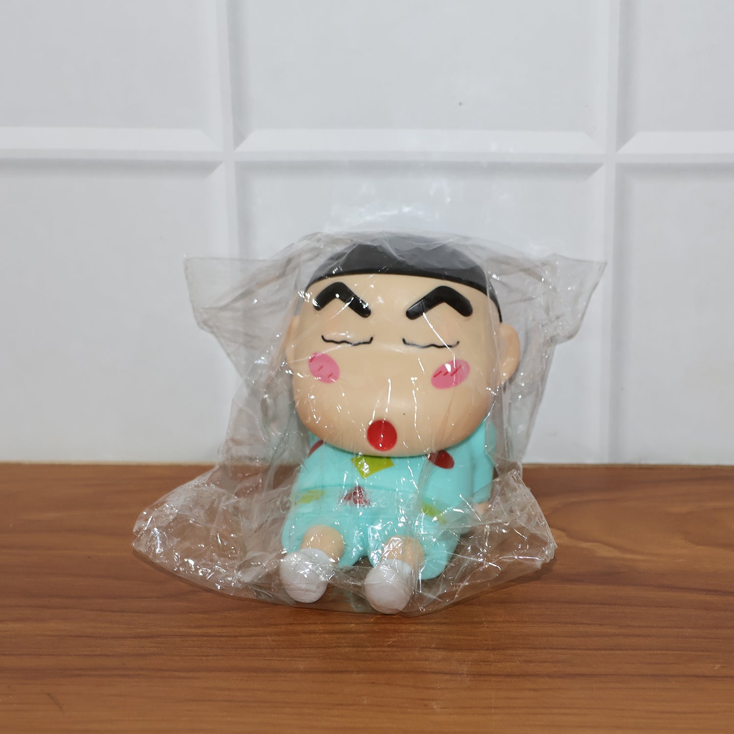Cute cartoon mobile phone stand displayed neatly on office desk
