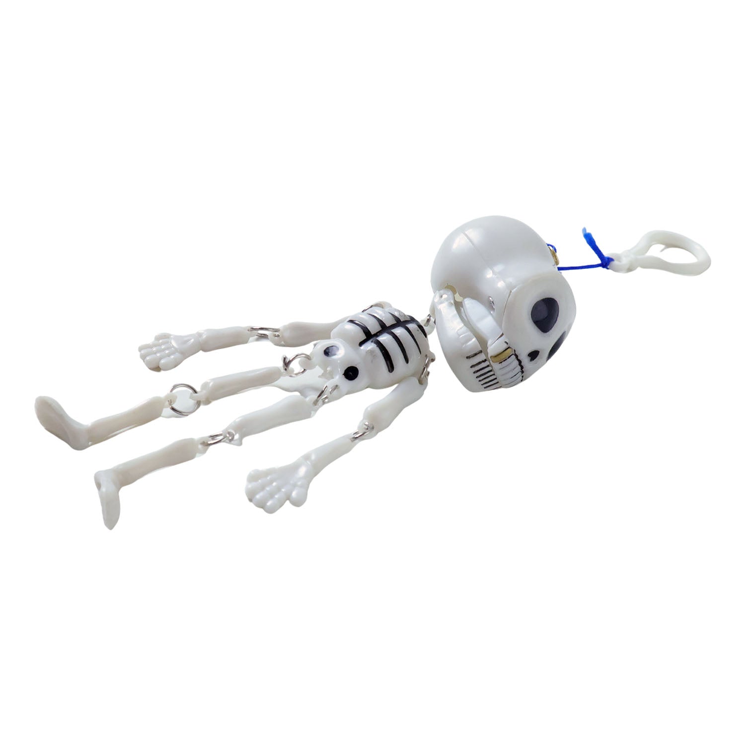 Skeleton doll hanging keychain clipped onto backpack zipper