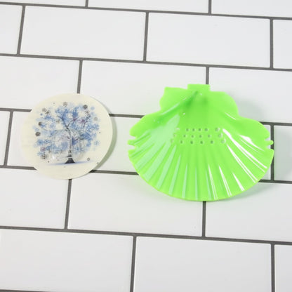 Wide spacious shell-shaped soap tray mounted on bathroom wall