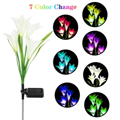 Outdoor solar garden flower lights installed in yard during nighttime