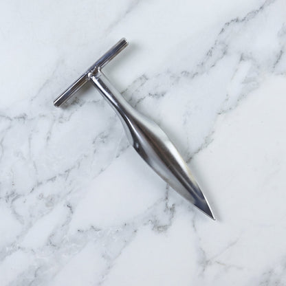 Stainless steel coconut breaker tool set displayed on a white background