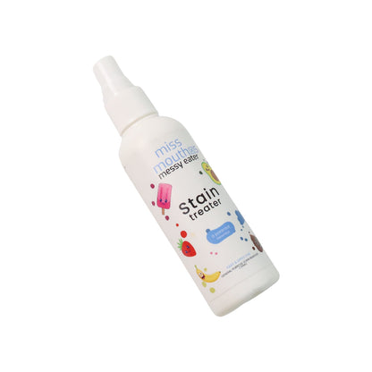 Using stain remover spray bottle on a visible fabric stain