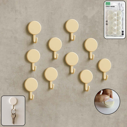 Set of 10 self adhesive round wall hooks arranged neatly for home organization