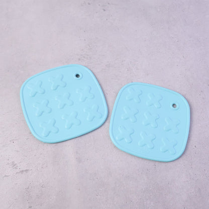 Cup coaster with secure textured non-slip surface for holding hot drinks