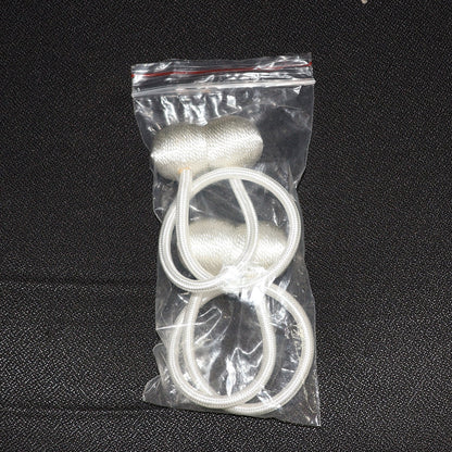 Elegant magnetic curtain tiebacks in a home setting, styling a window.