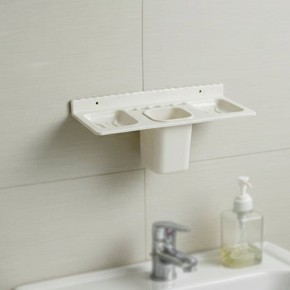 Close-up view of the detachable tumbler and toothbrush slots in the organizer.