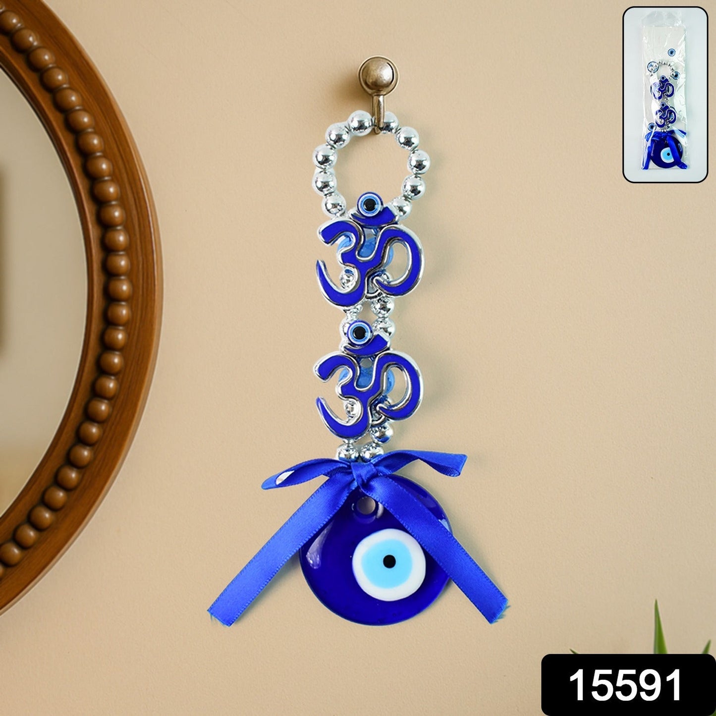 Wall hanging featuring decorative evil eye and twin OM symbols