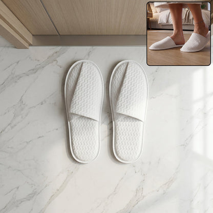 Hotel style white slippers for guest rooms