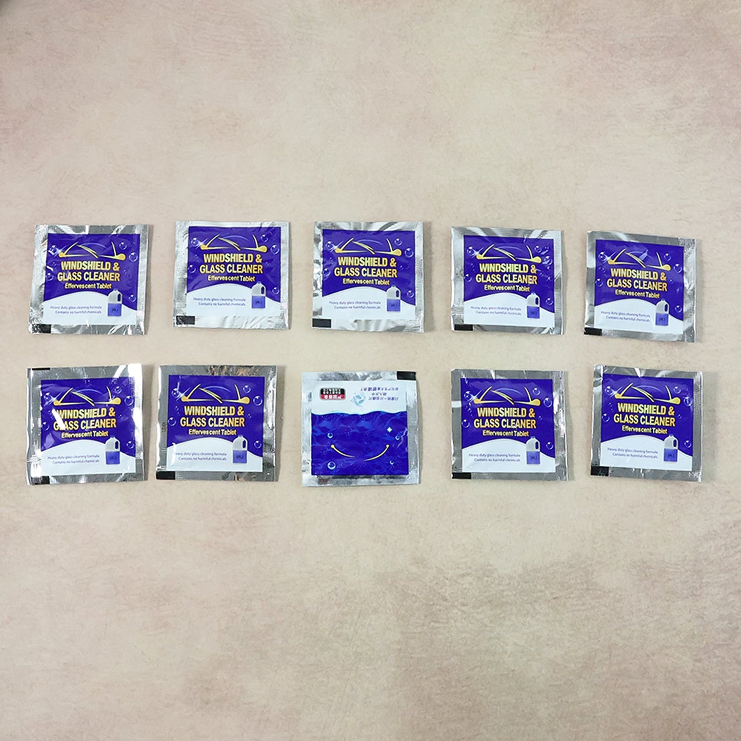 Display of effervescent car windshield cleaner tablets for vehicle maintenance