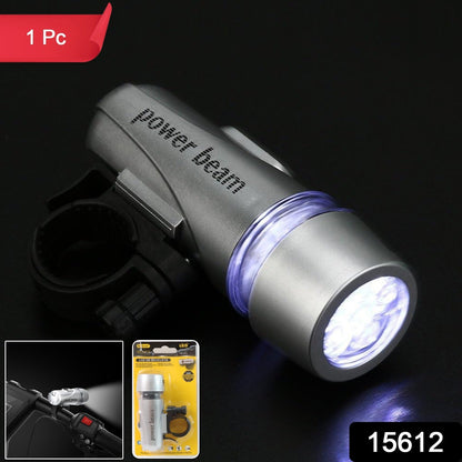 Powerful white LED bicycle headlight illuminating a dark road ahead.