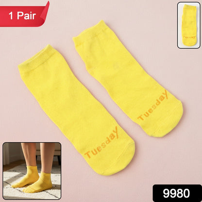 Bright yellow ankle-length casual socks with striped design