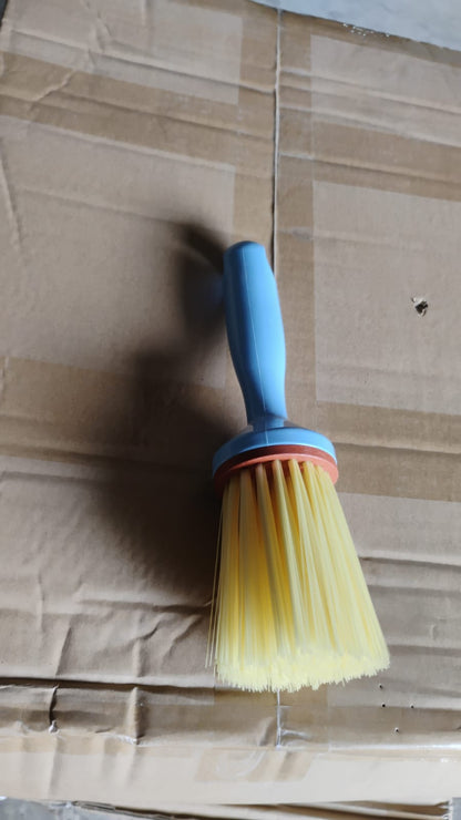 Multi-purpose plastic cleaning brush designed for kitchen and bathroom scrubbing