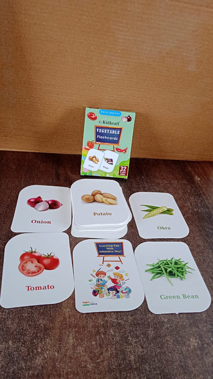 Assorted vegetable flash cards laid out for toddlers to learn vegetable names and images