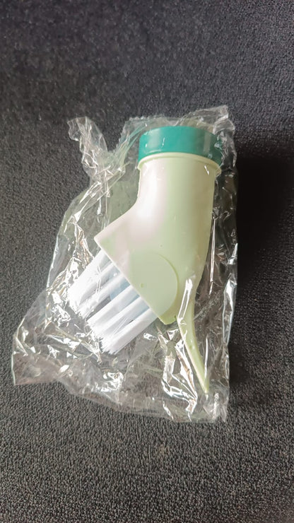 Cleaning brush connected to water bottle for easy water dispensing while scrubbing