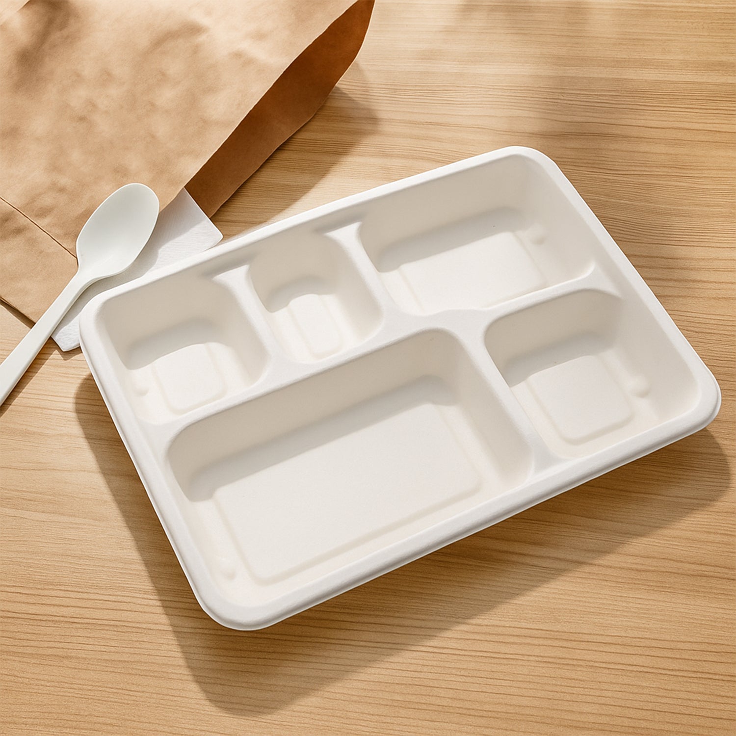 Natural color compostable lunch plate displaying five meal sections
