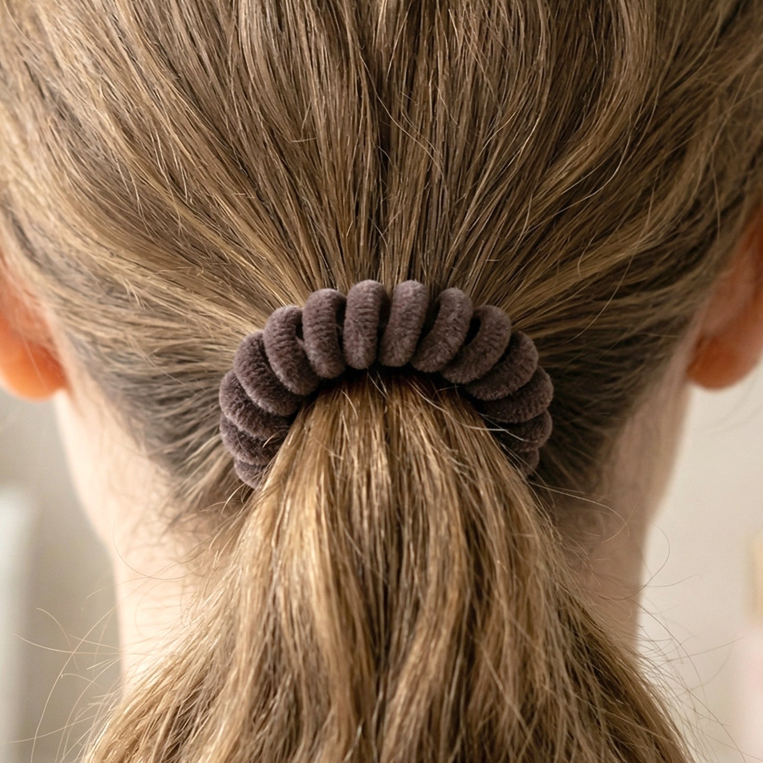 Flexible telephone wire hair band in coil design with stretch
