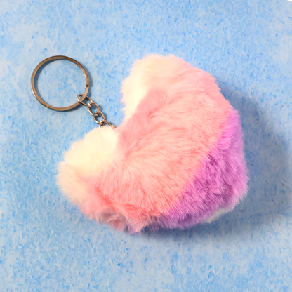 Close-up showing soft plush texture and metal ring of the heart keychain