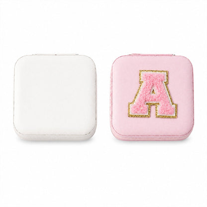 The LilyGleam travel jewellery box placed next to travel essentials like a passport and sunglasses.