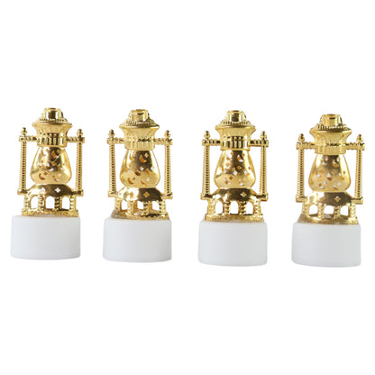 Three vintage lantern-style flameless LED tealights glowing in a dark setting.