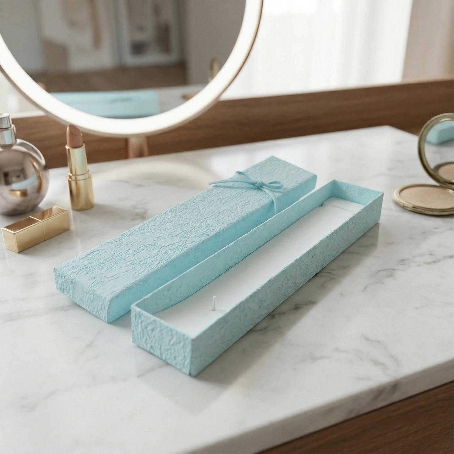 Long rectangular jewelry box with decorative ribbon closure and soft interior