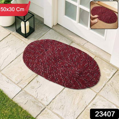 Textured red oval floor mat ideal for high-traffic areas