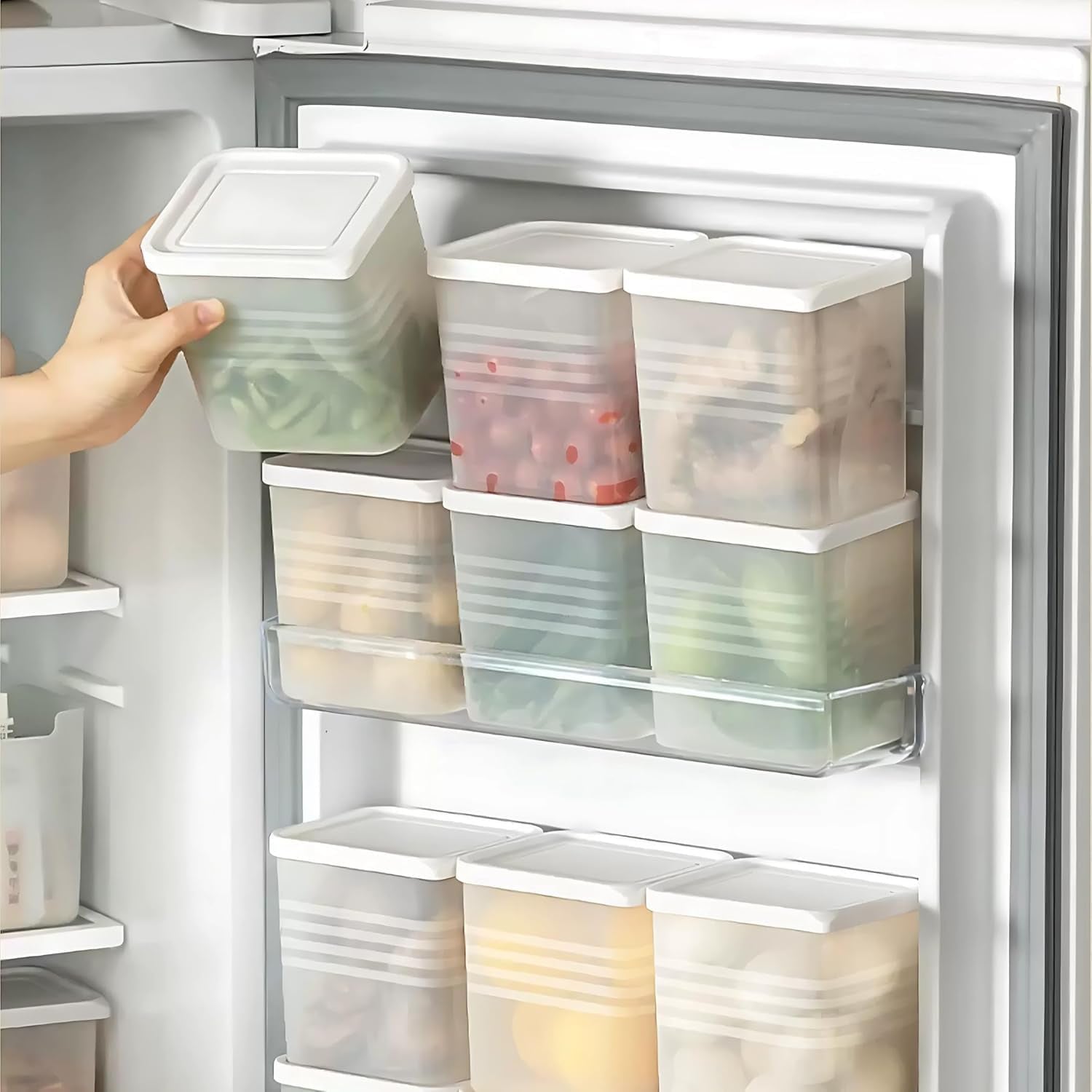 Stackable clear square plastic food storage containers neatly arranged in kitchen pantry
