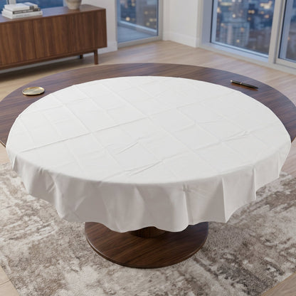 Folded round white table cover for storage and travel