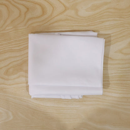 Round white table cover on a table for everyday use